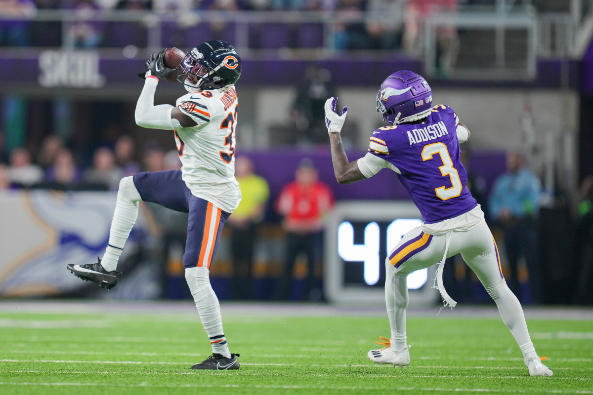Nov 27, 2023; Minneapolis, Minnesota, USA; Chicago Bears cornerback Jaylon Johnson (33) intercepts a pass intended for Minnesota Vikings wide receiver Jordan Addison (3) in the second quarter at U.S. Bank Stadium. Mandatory Credit: Brad Rempel-USA TODAY Sports